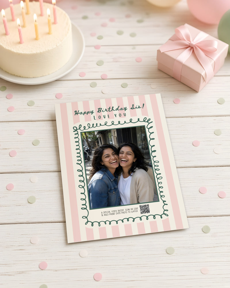 The Encore Card with a photo of two sisters, on a birthday party table with cake, confetti and balloons