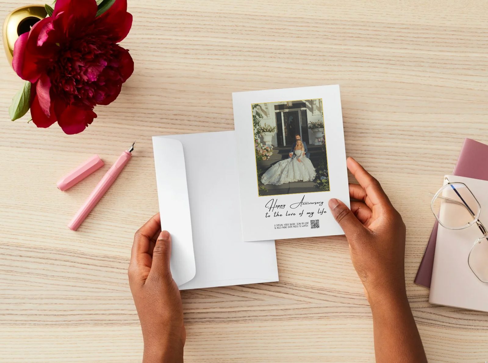 Hands holding a personalized card with a printed photograph